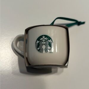 Starbucks Ceramic Coffee Mug Ornament NWT
2025 Holiday Edition